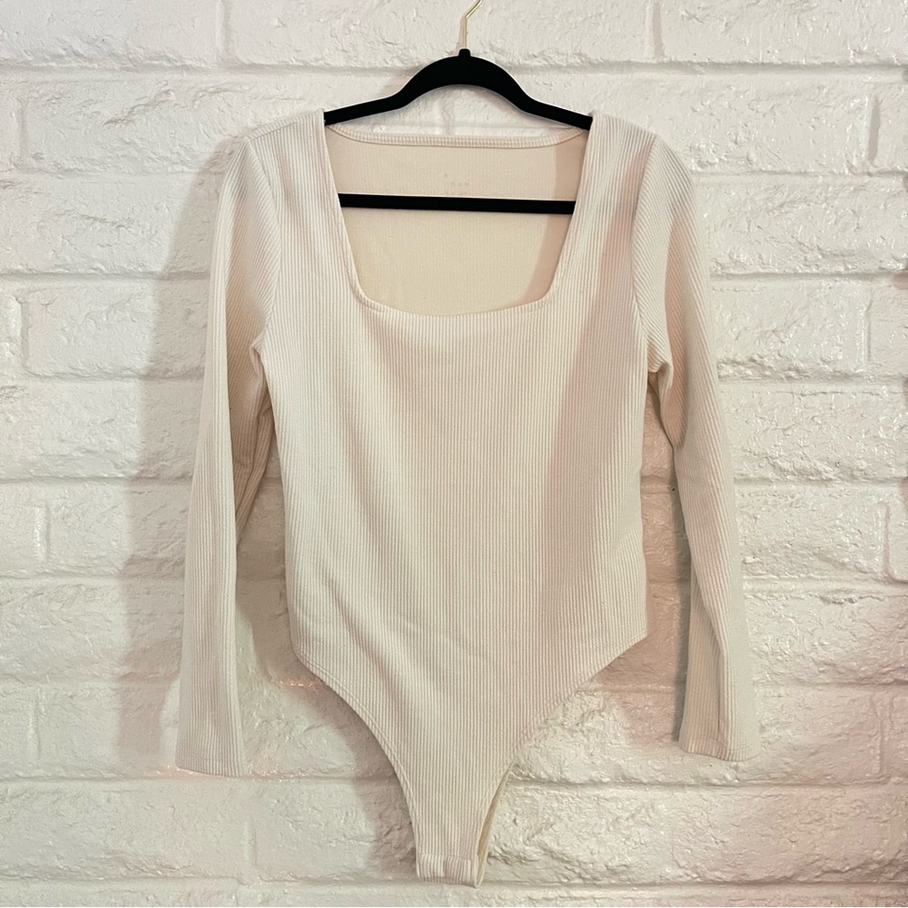 A NEW DAY BODYSUIT